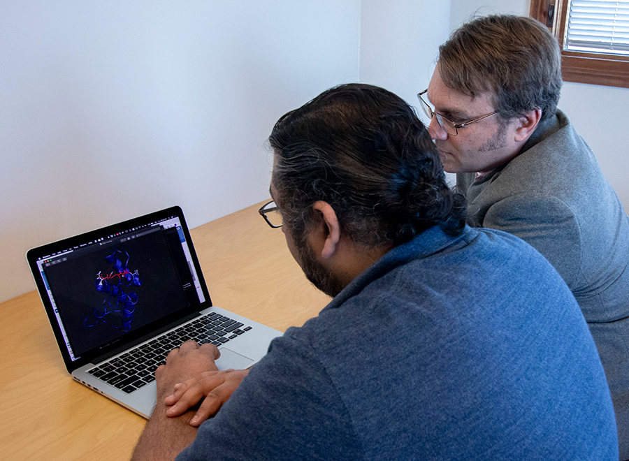 By applying Newtonian physics, Ashay Patel (left) and Michael Burkart (right), along with other researchers, could observe how metabolites behaved in the pocket, resulting in a time-resolved understanding of how proteins interact and catalyze specialized reactions. Photo by Michelle Fredricks, UC San Diego Physical Sciences