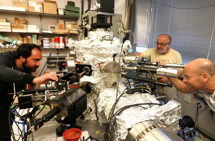 Left to right: Vargas, Monton and Schuller operate an ultra-high vacuum system called Organic Molecular Beam Epitaxy (OMBE) used to growth low dimensional metallic chains. Photo by Michelle Fredricks