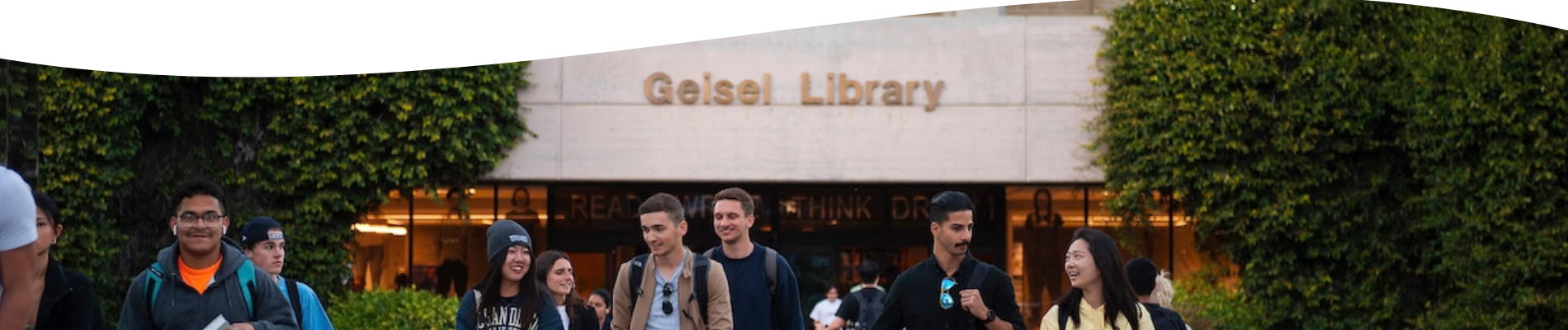 people walking outside of geisel library
