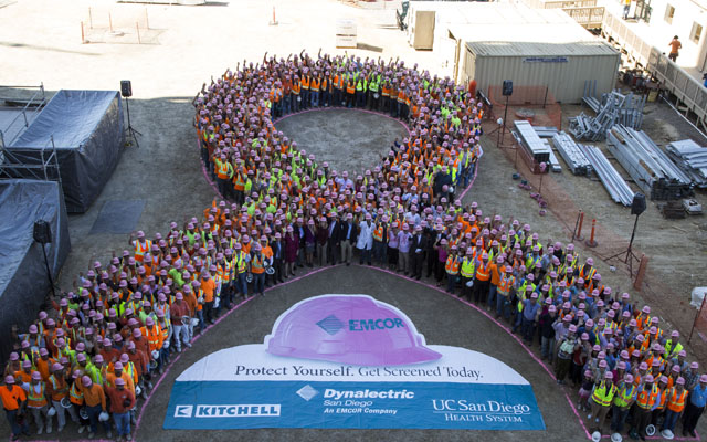 Health Care and Construction Workers Create Pink Ribbon For Breast