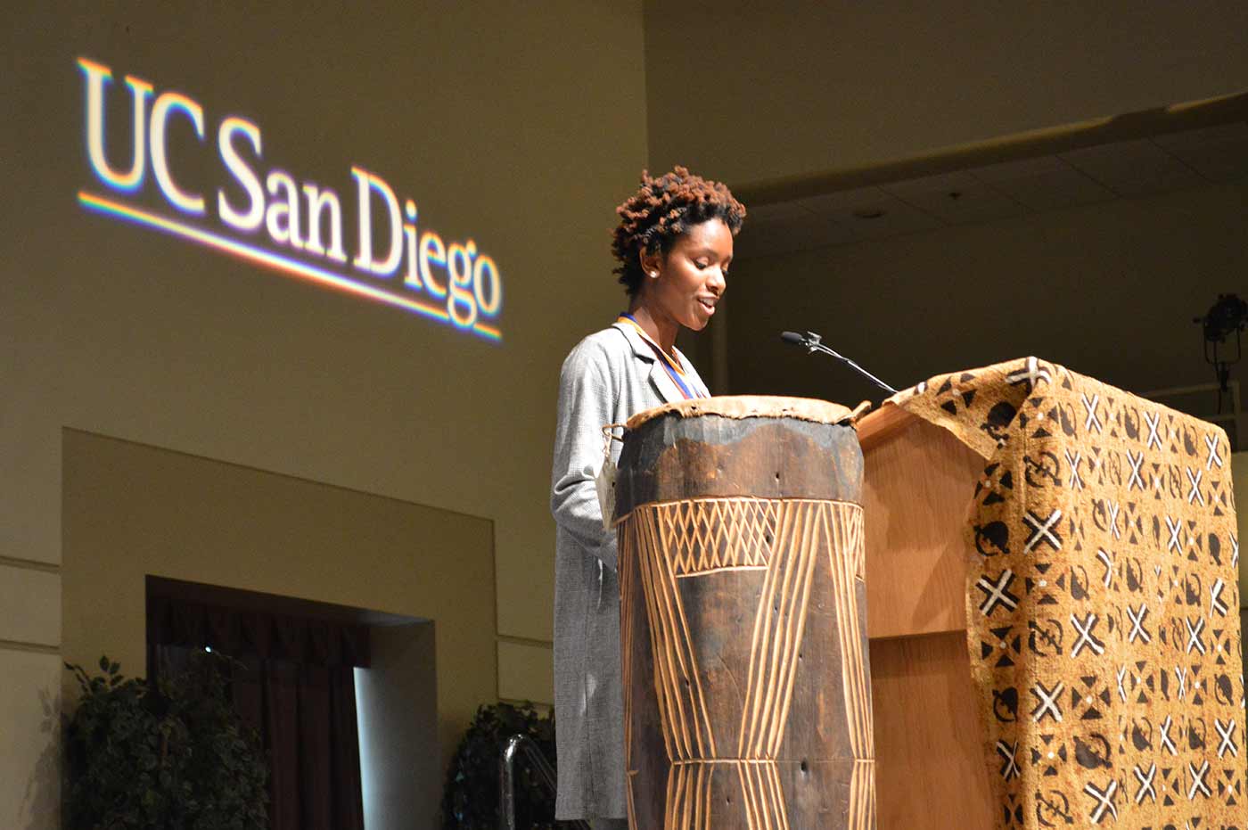 UC San Diego student at podium speaking