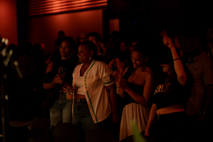 Crowd of people enjoying a performance.