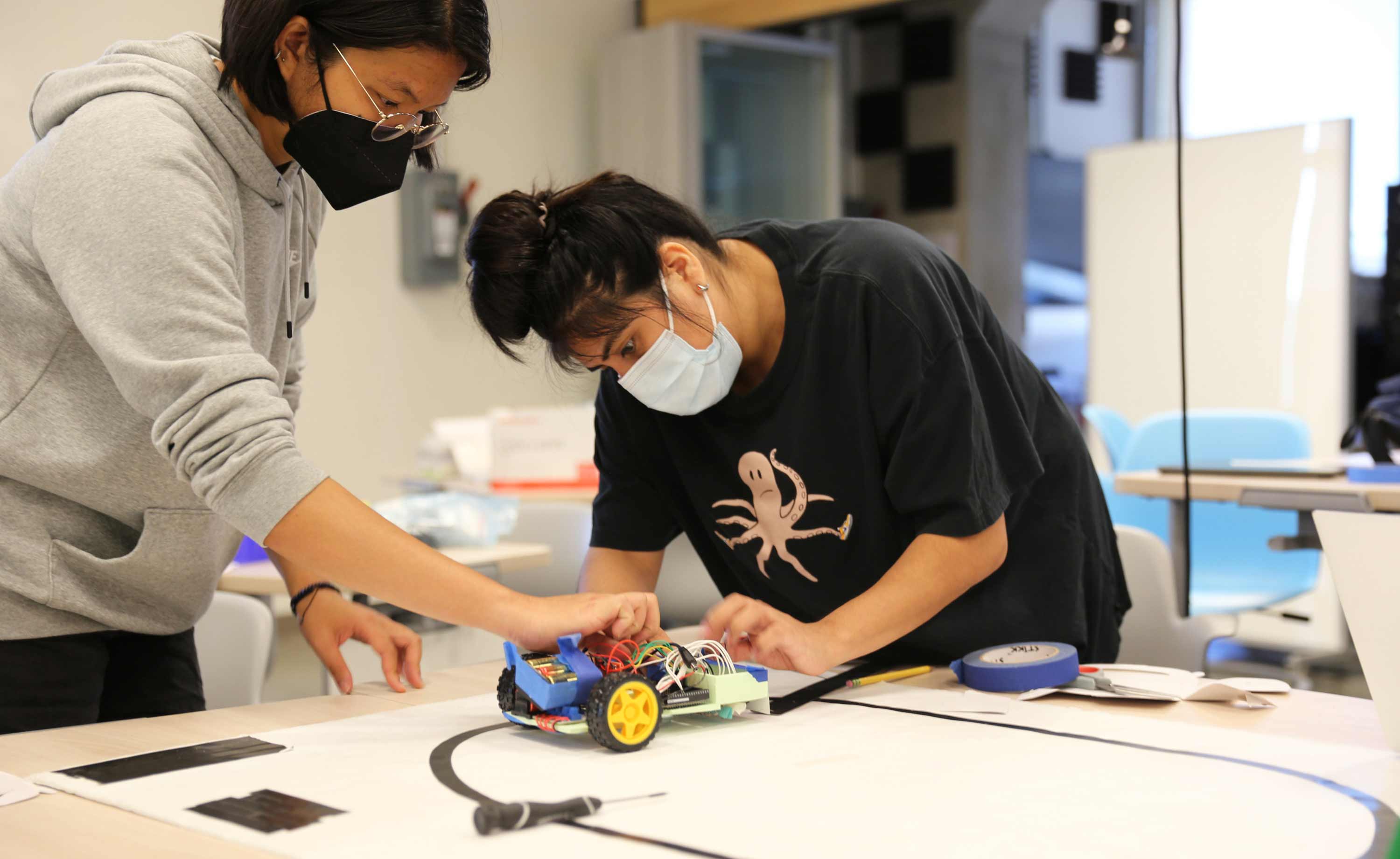 transfer student conducting research in a lab.