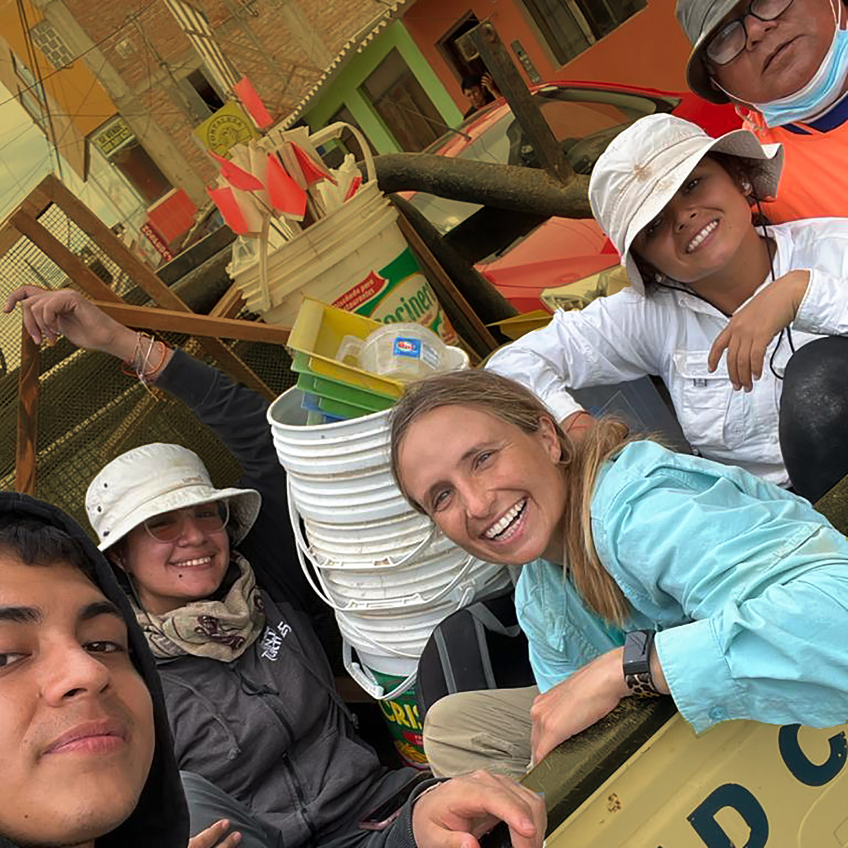 Arianna Garvin pictured sitting in the back of a truck with four other colleagues in Peru.