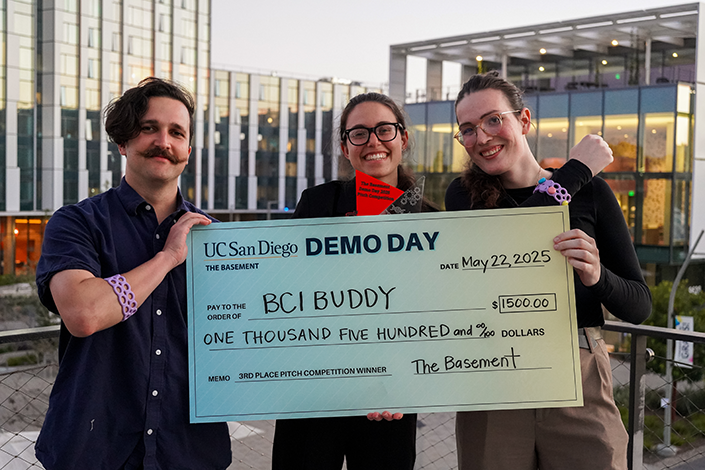 BCI Buddy takes home Third Place, featuring (left to right) Ollie D'Amico, Cassia Rizq, and Vittoria Tenino.