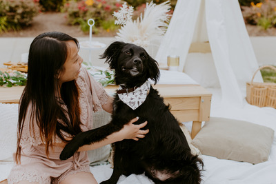 Alice Chen and her dog with a Cookies & Co. bandana.