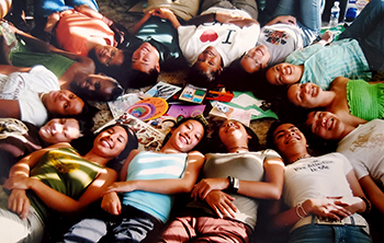 UC San Diego students lying on the floor in a circle at the Cross-Cultural Center