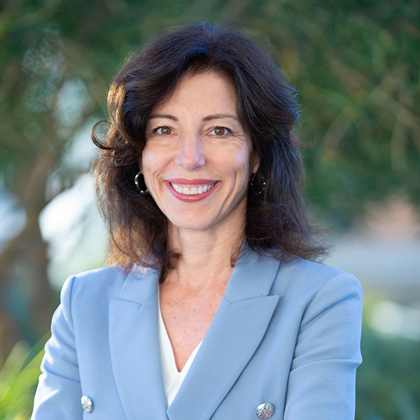 Outdoor portrait of Amanda Datnow in blue jacket