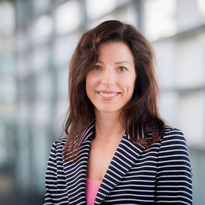 Portrait of Amanda Datnow in black and white striped blazer