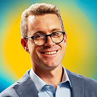Man in glasses against yellow background