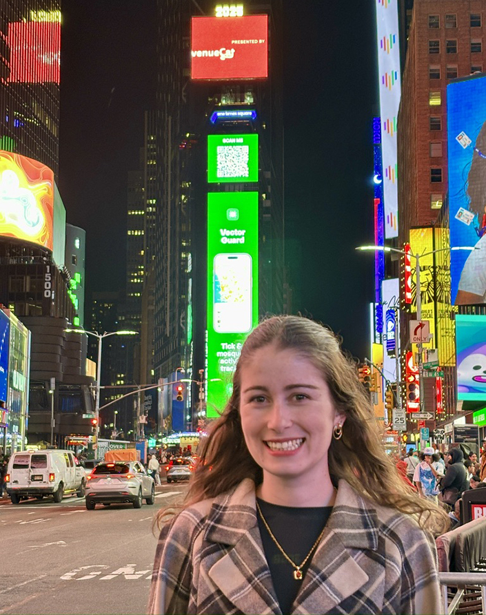 Ellie Fausett in Times Square with Vector Guard billboard
