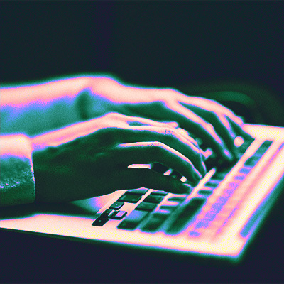 Stylized image of hands typing on computer keyboard.