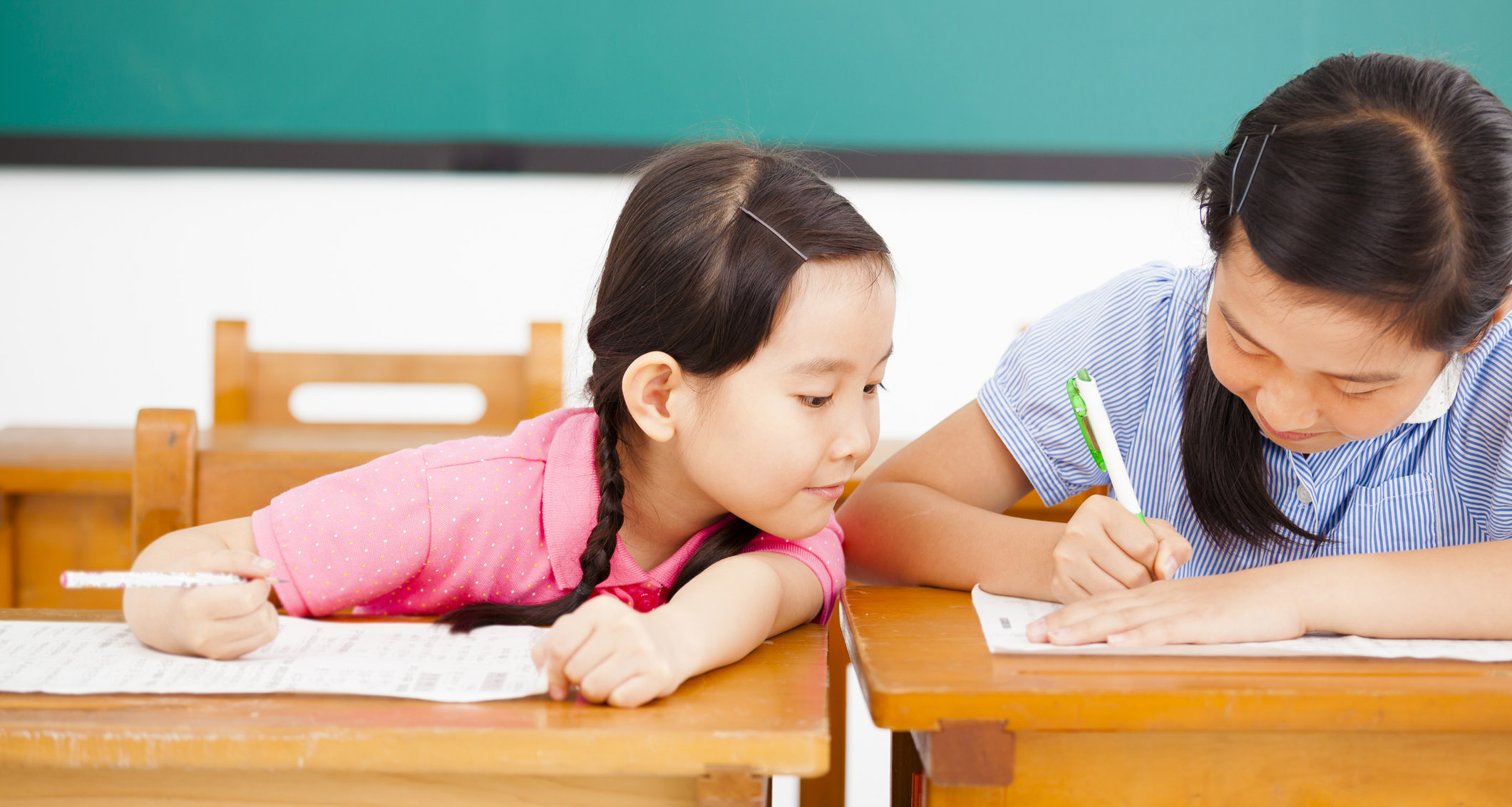 Little girl trying to cheat on test.