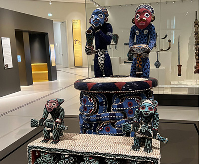 A photo of displayed African artifacts that look to be sculptures of humans