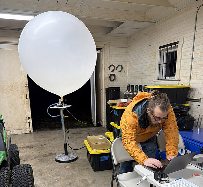 Scientist getting ready to launch a weather balloon