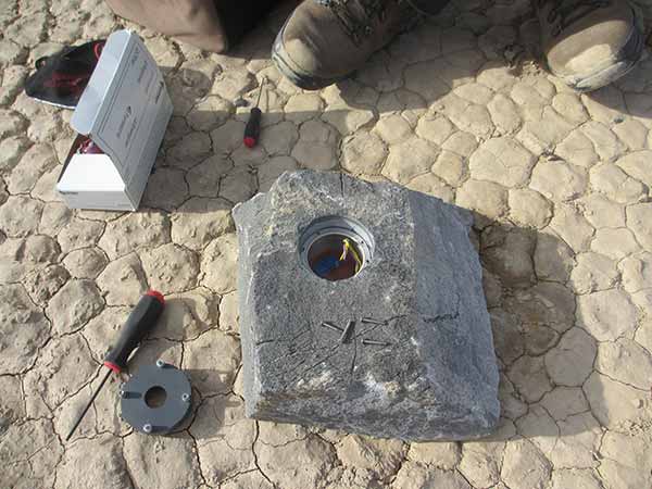 rock with the cavity that held the GPS instrument package and its battery pack