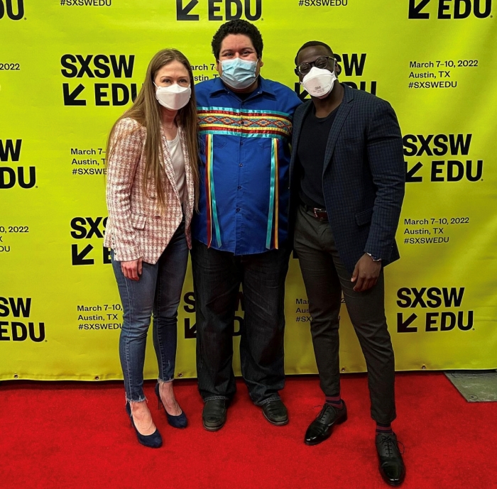 Calac poses with Chelsea Clinton and Joel Bervell at the 2022 SXSW Conference