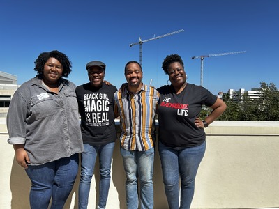 Keynote speaker Professor Stephen Quaye takes picture with event participants.