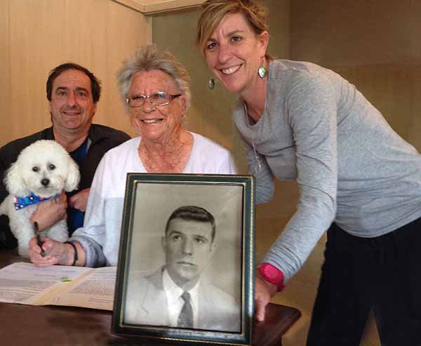 Image: Betty Beyster signing the deed of gift with her children, Jim and Mary Ann Beyster