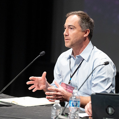 Man speaking into microphone