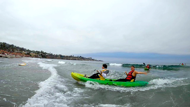 Two students kayak at La Jolla Shores