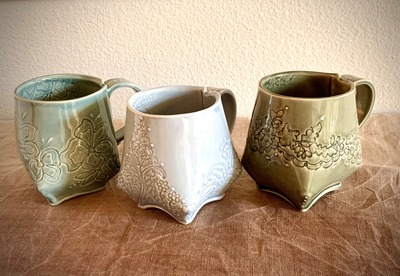 Functional items for sale include mugs featuring a European lace design. Credit: Hiromi Minemura