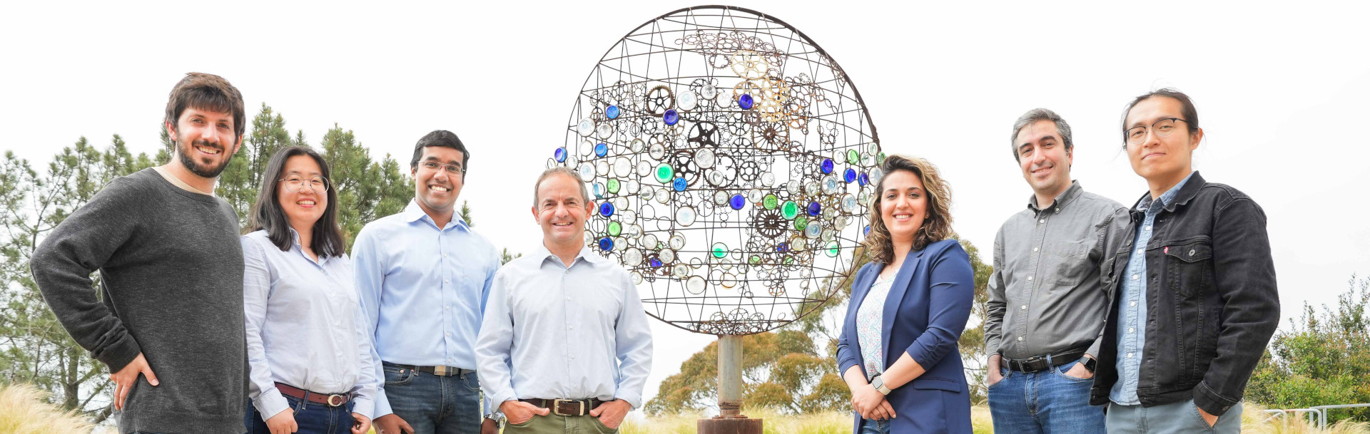 CW3E Machine Learning Team gather around Atmospheric Rivers statue