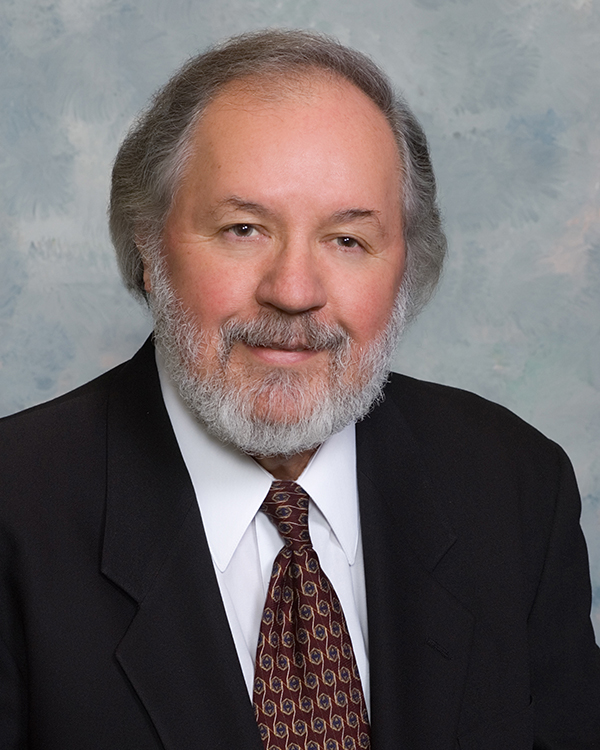 Portrait of bearded Randy Hampton in suit and tie