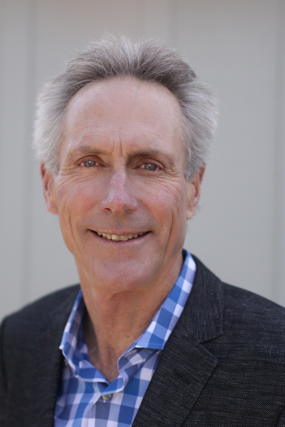 Headshot of a person smiling at camera