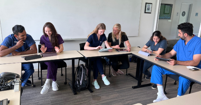 Medical students collaborate in the classroom using iPads from the Triton MedTech Program.