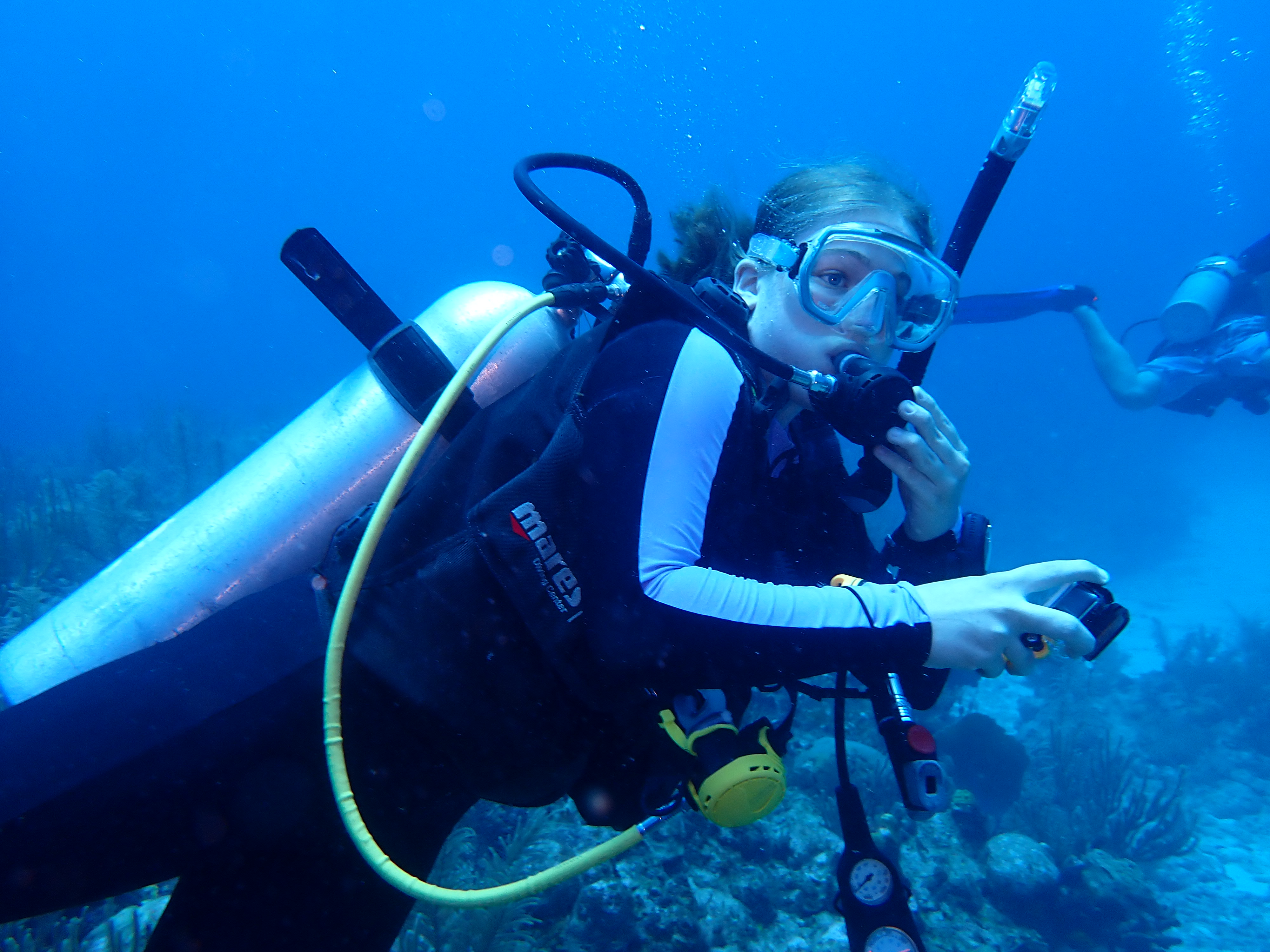 Student scuba diving underwater 