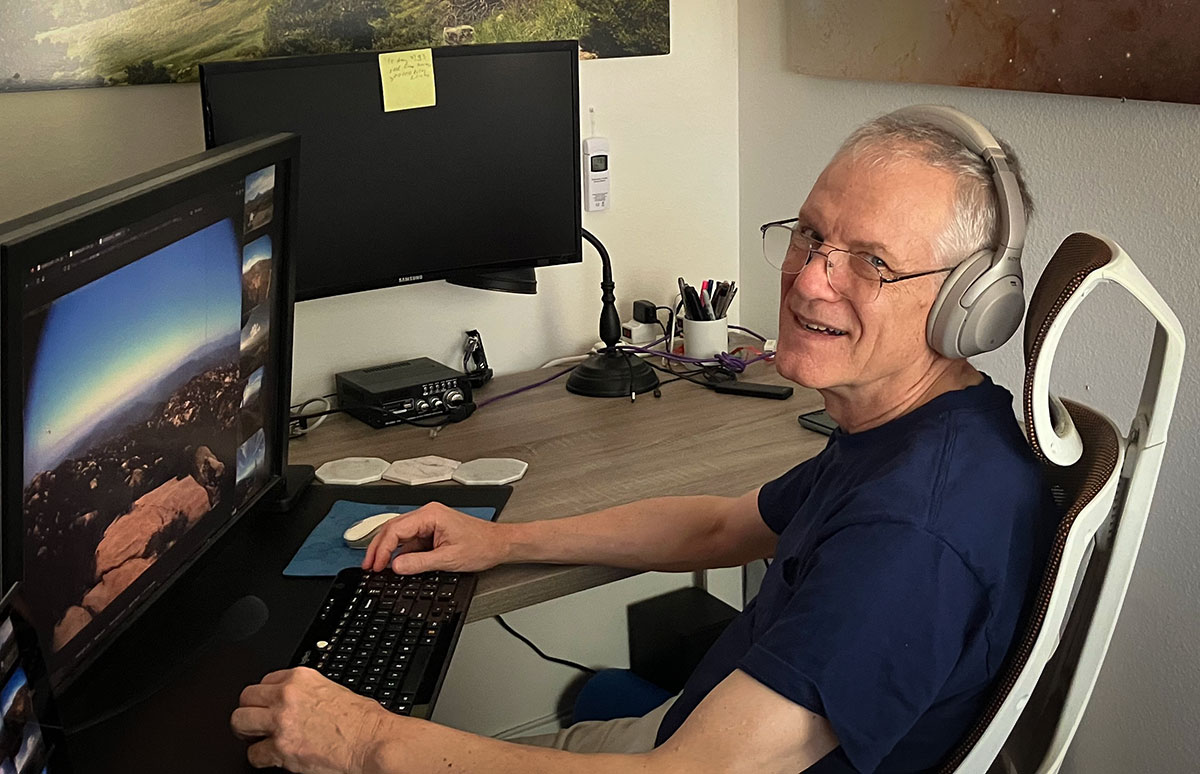 HPWREN's co-founder Hans-Werner Braun sits at his computer monitoring remote images from the project's tower-mounted cameras.