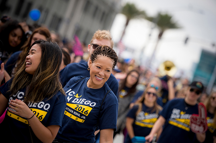Vice Chancellor Petitt smiles as she walks alongside campus members in the annual Martin Luther King Jr. parade downtown.