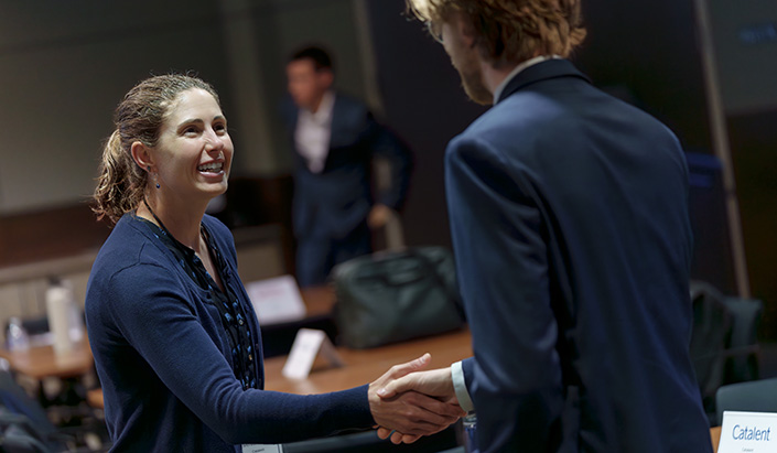 Handshake and a bright student smile