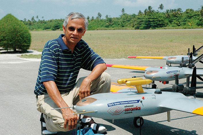 Professor Ramanathan in the Maldives with an autonomous uncrewed aerial vehicle, used in a 2006 study to measure the atmospheric brown cloud over South Asia.