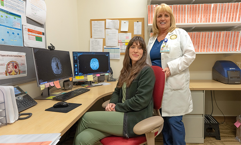 Karen Rapp (right) and worker on chair (bottom left)