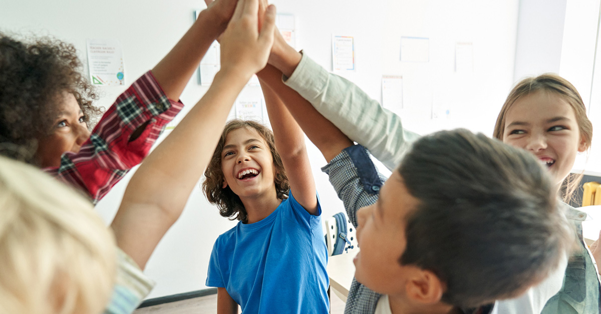 School kids high-fiving