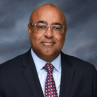 Headshot of man with tie