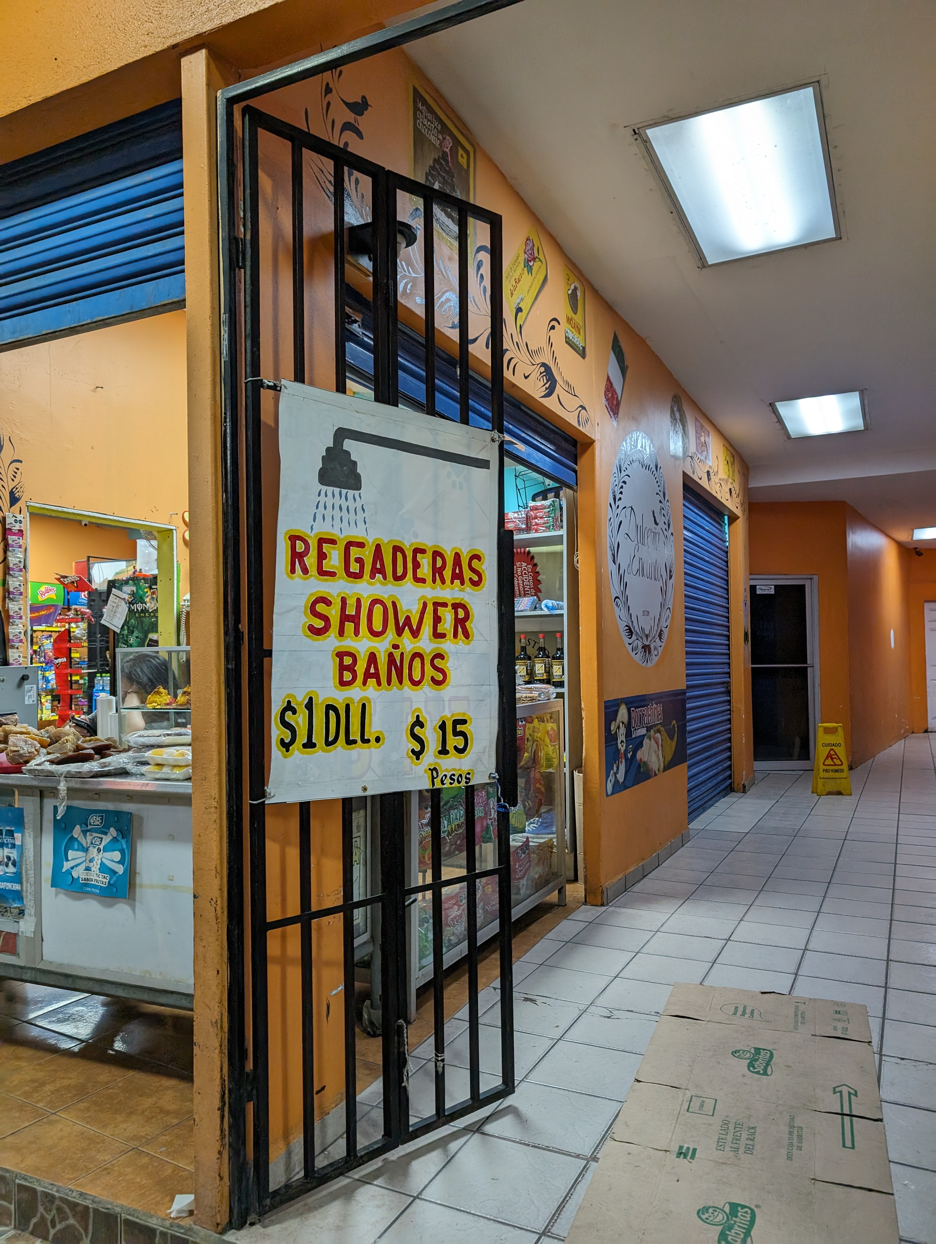 Sign for showers available in Tijuana at a cost of $1 or $15 pesos. 