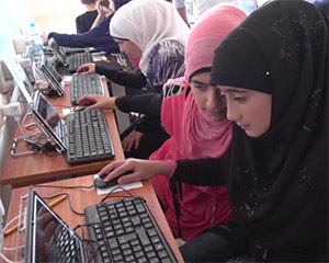 Children in Syrian refugee camp using Learning Equality software