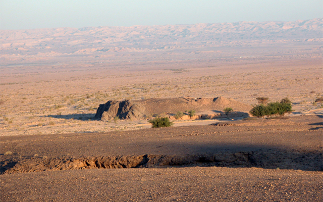 panoramic view of outcropping in Jordanian desert, Tel Tifdan, where artifacts were excavated for use in the study of Earth's magnetic field