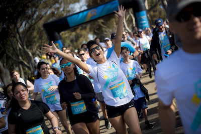 Triton 5K runner crosses finish line
