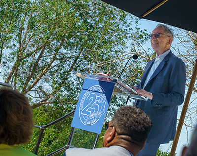 Irwin Jacobs speaks at a podium