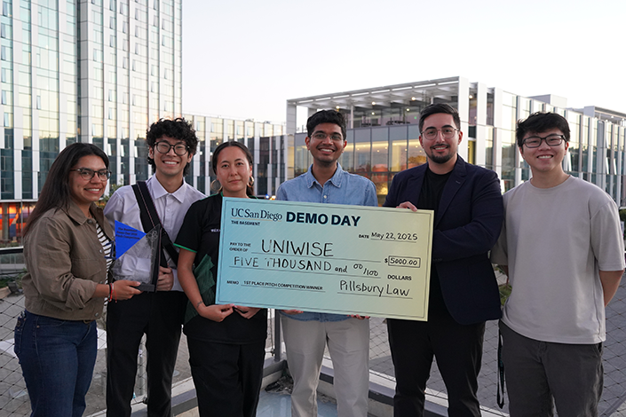 Tristin Esfandiari and the UniWise team win First Place.