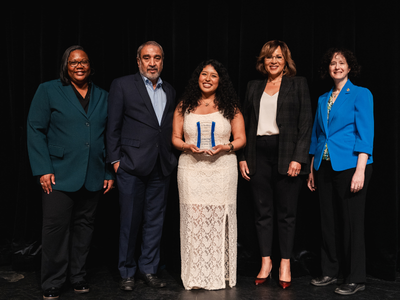 A group of campus leaders pose for a photo with award winner Leslie Vallego Avila.