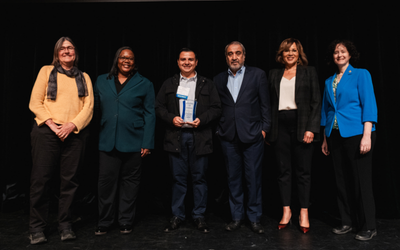 A group of campus leaders pose for a photo with award winner Raúl Navarro Rodríguez, senior learning technologies analyst.