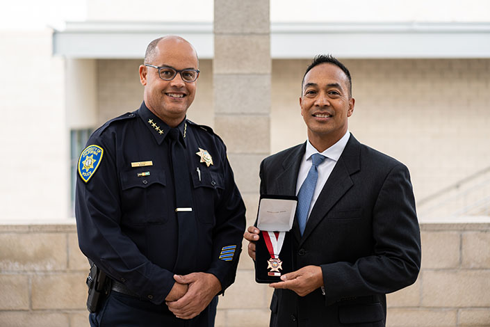 UC San Diego Chief of Police Lamine Secka (left) and Officer Roy Vicente. Vicente was recognized with the Lifesaving Award from the University of California system at a ceremony on campus this month.