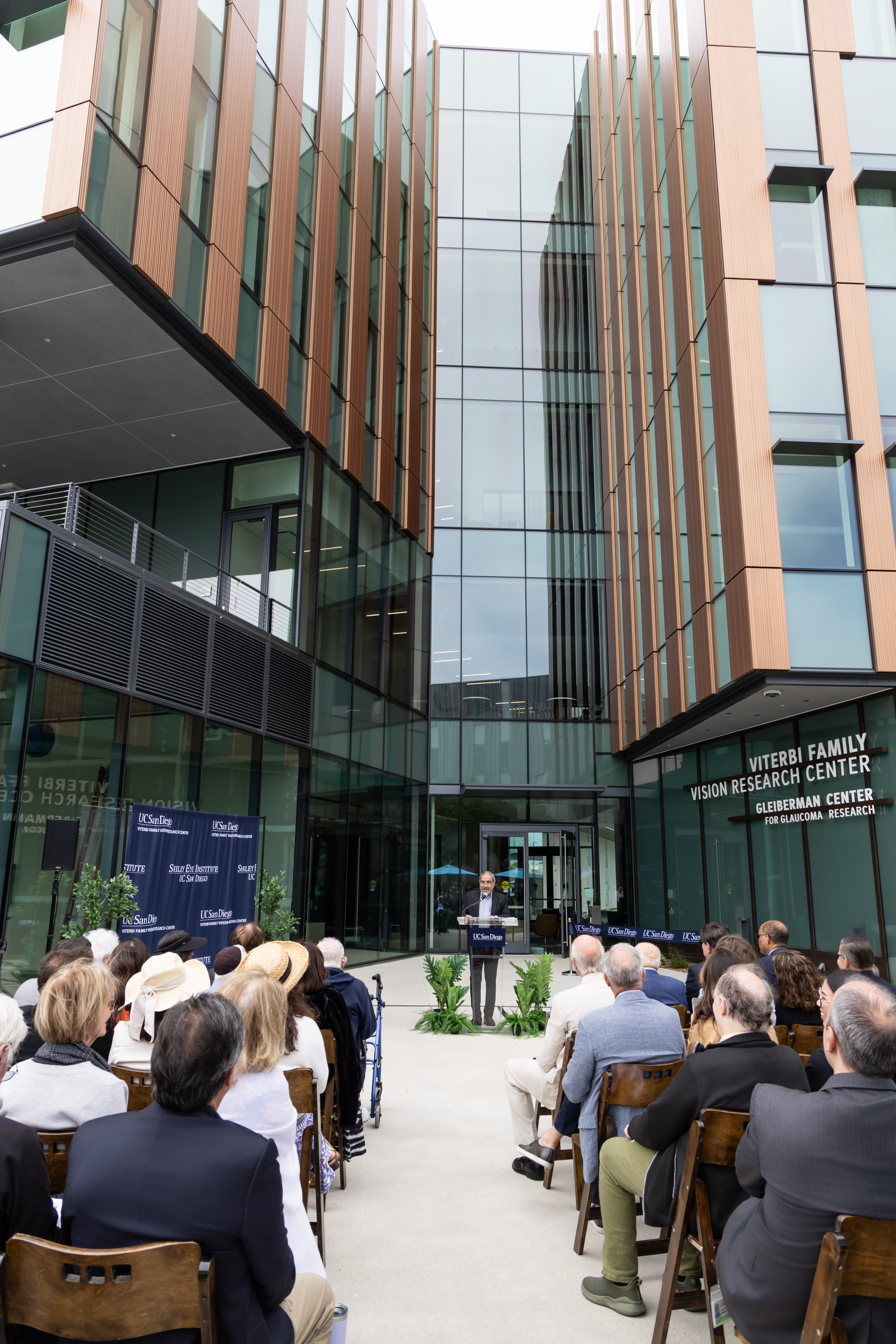 Photo of Chancellor Khosla spoke to an audience in front of the new building.