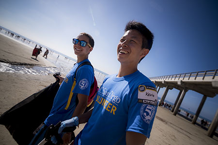 UC San Diego students volunteer on the beach.