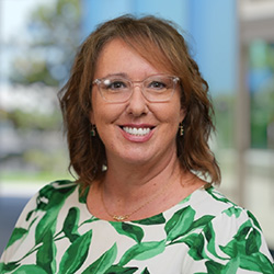 Wendy Hunter Barker in green floral blouse